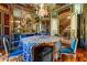 Formal dining room with blue and gold decor, and views to a staircase at 2288 Peachtree Nw Rd # 6, Atlanta, GA 30305