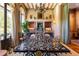 Formal dining room with ornate marble table and built-in grilling station at 2288 Peachtree Nw Rd # 6, Atlanta, GA 30305