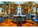 Stunning formal dining room with blue walls, gold accents, and crystal chandelier at 2288 Peachtree Nw Rd # 6, Atlanta, GA 30305