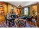 Elegant library features wood paneling, a fireplace, and comfortable seating at 2288 Peachtree Nw Rd # 6, Atlanta, GA 30305