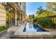 Long, linear pool with stone coping and lush landscaping at 2288 Peachtree Nw Rd # 6, Atlanta, GA 30305