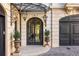 Elegant entryway with ornate iron door and planters at 2288 Peachtree Nw Rd # 6, Atlanta, GA 30305