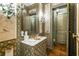 Powder room with marble vanity and hand-painted wallpaper at 2288 Peachtree Nw Rd # 6, Atlanta, GA 30305