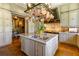 Elegant kitchen boasts granite countertops, custom cabinetry, and a pot rack at 2288 Peachtree Nw Rd # 6, Atlanta, GA 30305