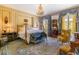 Spacious bedroom with ornate bed, sitting area and large windows at 2288 Peachtree Nw Rd # 6, Atlanta, GA 30305
