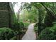 Charming garden path with archway and lush greenery at 2288 Peachtree Nw Rd # 6, Atlanta, GA 30305