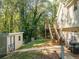 Backyard with deck, shed, and wooded area at 304 Ridge Hill Cir, Canton, GA 30115
