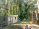 Backyard with deck, shed, and wooded area at 304 Ridge Hill Cir, Canton, GA 30115