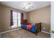 Charming bedroom with large window and ceiling fan at 304 Ridge Hill Cir, Canton, GA 30115