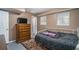 Basement bedroom with double bed, dresser, and access to bathroom at 304 Ridge Hill Cir, Canton, GA 30115