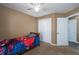 Cozy bedroom with double door closet and ceiling fan at 304 Ridge Hill Cir, Canton, GA 30115
