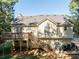 Back of house with deck, stairs, and fenced yard at 304 Ridge Hill Cir, Canton, GA 30115
