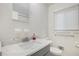 Clean bathroom featuring a marble countertop, sink, and toilet at 2210 Rhinehill Se Rd, Atlanta, GA 30315
