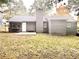 Gray house with backyard, patio, and grassy area at 331 Cheryl Ct, Jonesboro, GA 30238
