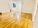 Hardwood floor living room with access to dining area at 331 Cheryl Ct, Jonesboro, GA 30238