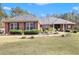 Brick ranch home with landscaped yard at 2870 Peeksville Rd, Locust Grove, GA 30248