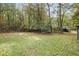 Wooded backyard with a large grassy area at 159 S Forty W Pass, Hiram, GA 30141