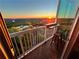 Balcony with sunset view and two stools at 3300 Windy Ridge Se Pkwy # 1401, Atlanta, GA 30339