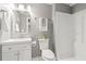 Modern bathroom with white vanity, shower, and gray walls at 208 Silver Springs Sw Cir, Atlanta, GA 30310