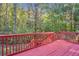 Spacious red deck overlooks wooded backyard at 110 Big Elk Sw Ct, Atlanta, GA 30349