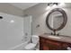 Bathroom with tub/shower combo, vanity, and granite countertop at 110 Big Elk Sw Ct, Atlanta, GA 30349