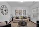 Living room with neutral colored couch and coffee table at 110 Big Elk Sw Ct, Atlanta, GA 30349