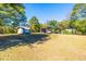 Large grassy area with various sheds and mature trees at 4800 Pisgah Rd, Cumming, GA 30028