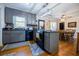 Modern kitchen with gray cabinets, granite countertops, and island at 4800 Pisgah Rd, Cumming, GA 30028