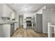 Modern kitchen with stainless steel appliances and light-colored cabinets at 2988 Woodrow Mnr, Lithonia, GA 30038