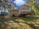 Two-story house with wooden deck and a spacious backyard at 2988 Woodrow Mnr, Lithonia, GA 30038