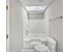 Updated bathroom with a bathtub, shower, and skylight at 2988 Woodrow Mnr, Lithonia, GA 30038