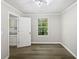 Bright bonus room with neutral walls, vinyl flooring, and a window at 2988 Woodrow Mnr, Lithonia, GA 30038