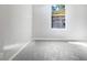 Spacious bedroom with neutral-colored carpet and large window at 2988 Woodrow Mnr, Lithonia, GA 30038