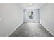Bright bedroom with neutral walls and grey carpet at 2988 Woodrow Mnr, Lithonia, GA 30038