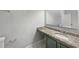 Clean bathroom with granite countertop vanity and updated fixtures at 2988 Woodrow Mnr, Lithonia, GA 30038