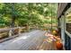 Deck with fall decor and stairs leading down to the yard at 140 Walker Woods Dr, Carrollton, GA 30116