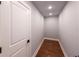 Neat storage room with hardwood floors and a white door at 140 Walker Woods Dr, Carrollton, GA 30116