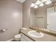 Clean and updated bathroom with a large vanity mirror and golden fixtures at 346 Carpenter Dr # 85, Sandy Springs, GA 30328