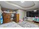 Finished basement bedroom with large TV and ample storage at 422 White Oak Nw Dr, Lilburn, GA 30047