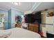 Primary bedroom with large TV and walk-in closet at 422 White Oak Nw Dr, Lilburn, GA 30047
