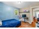 Bedroom with wood floors, a double bed, and access to another room at 422 White Oak Nw Dr, Lilburn, GA 30047