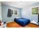 Bright bedroom with wood floors and ample natural light at 422 White Oak Nw Dr, Lilburn, GA 30047