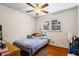 Bedroom with hardwood floors and a window overlooking the backyard at 422 White Oak Nw Dr, Lilburn, GA 30047