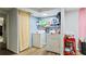 Basement laundry room with washer, dryer, and extra shelving at 422 White Oak Nw Dr, Lilburn, GA 30047