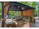 Covered gazebo with seating area and grill at 422 White Oak Nw Dr, Lilburn, GA 30047
