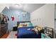 bedroom with dinosaur wall decals and built-in closet at 422 White Oak Nw Dr, Lilburn, GA 30047