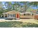 Charming ranch home with red door and landscaped yard at 2434 Miriam Ln, Decatur, GA 30032