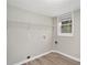 Laundry room with shelving, vinyl flooring and window at 2434 Miriam Ln, Decatur, GA 30032