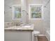 Bathroom boasts granite countertop, white vanity, and updated fixtures at 2434 Miriam Ln, Decatur, GA 30032