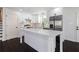Modern kitchen with white cabinets, stainless steel appliances, and quartz countertops at 504 Milligan Dr, Stone Mountain, GA 30083